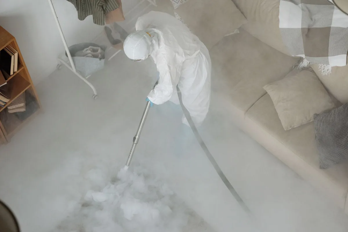 Biohazard cleanup technician in protective equipment, Helmetta, NJ